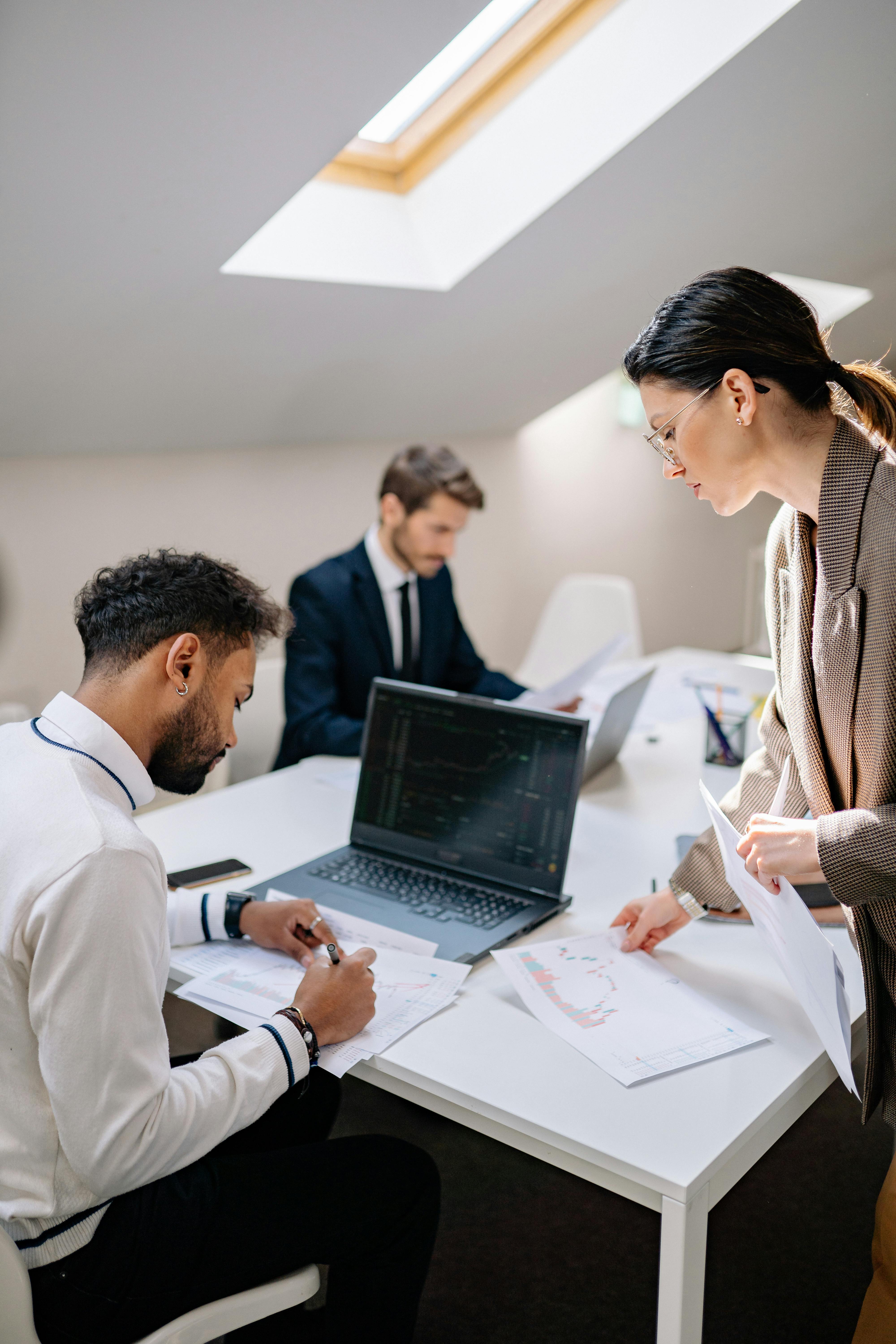 Research analyst reviewing sampling framework documentation and incidence rate data